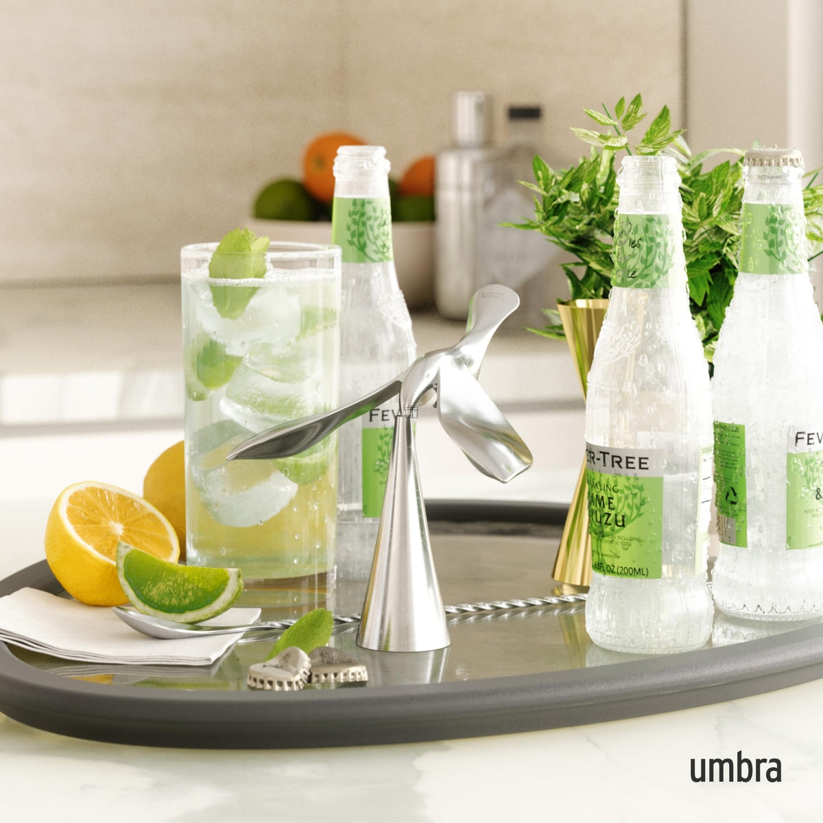 Umbra Tipsy balances on edge, offering a playful yet practical bottle-opening experience.