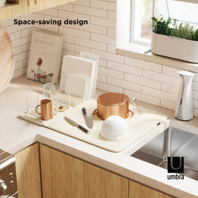 Umbra Udry customizable pegs along the rack for varied items