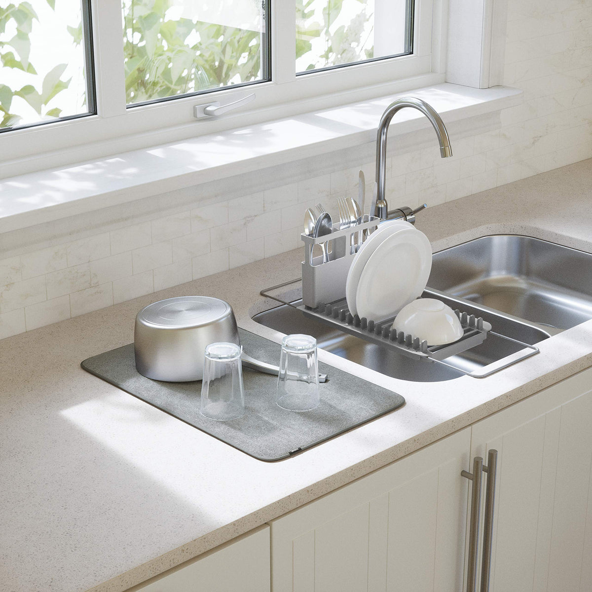 Umbra UDry microfiber drying mat absorbs water and protects countertops during drying.