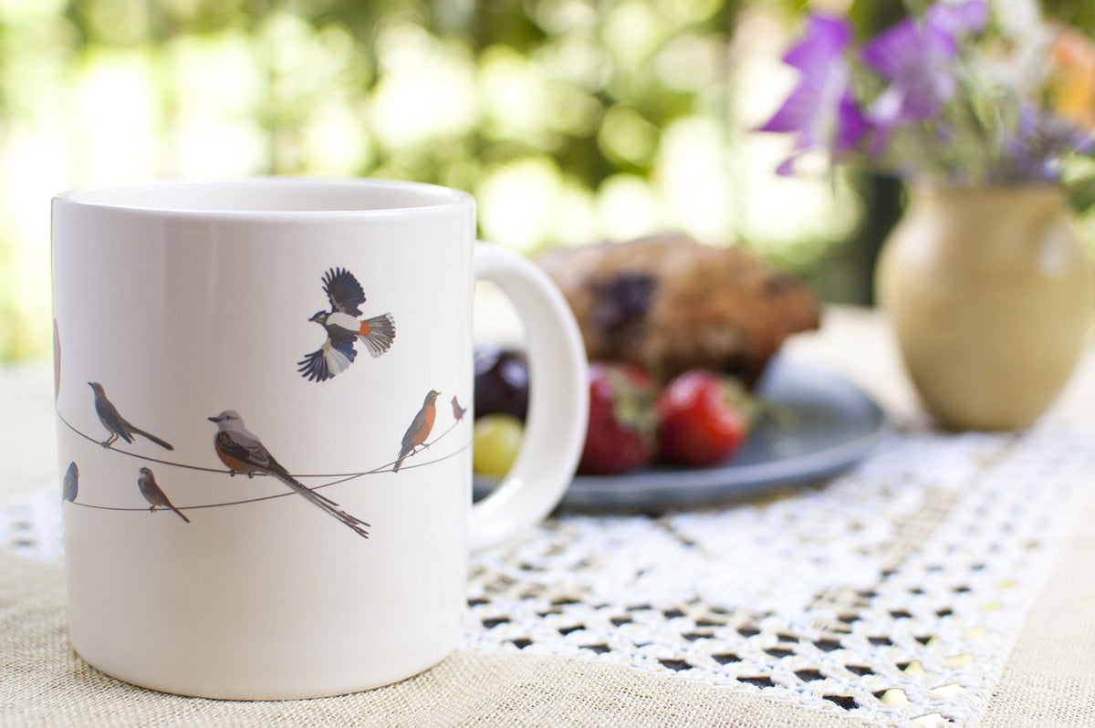The Unemployed Philosophers Guild Birds on a Wire mug is microwave safe
