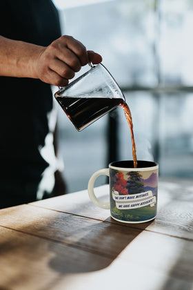 The Bob Ross 12oz ceramic mug with comfortable handle ready for daily use.