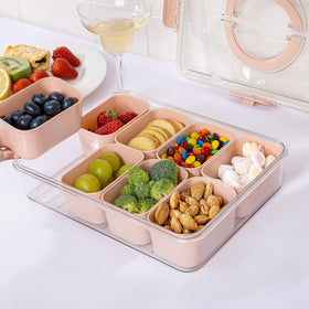 U-QE Snackle Box shown at picnic or road trip for on-the-go snacks.