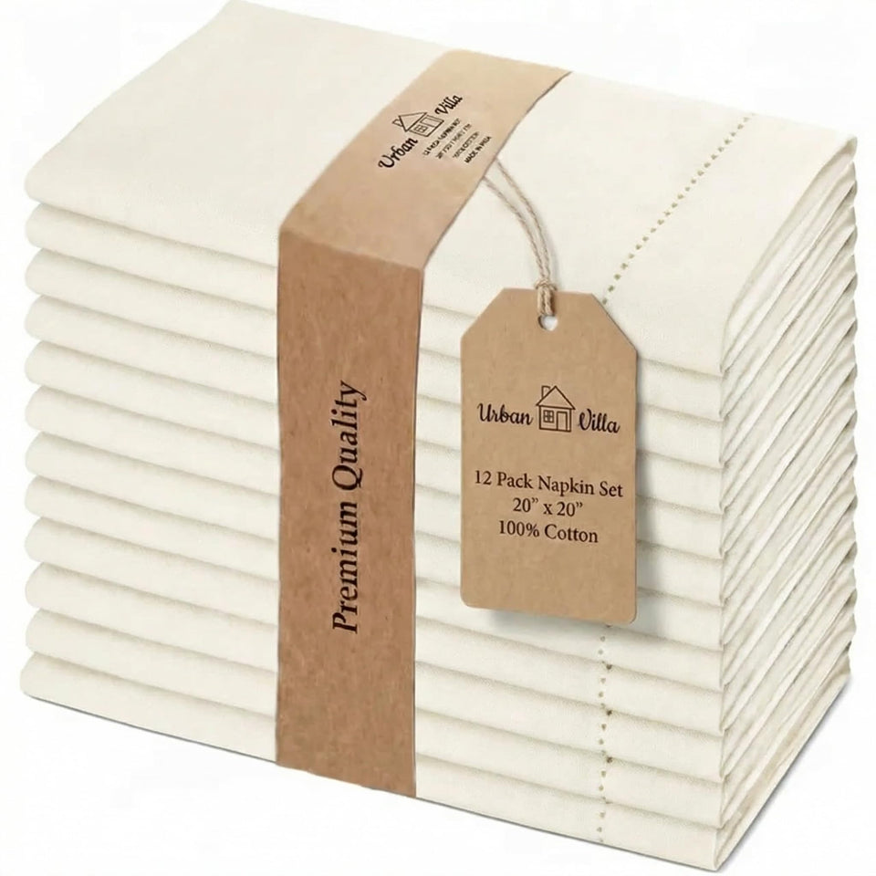 Urban Villa ivory hemstitch napkins on a table for elegant dinner decor.
