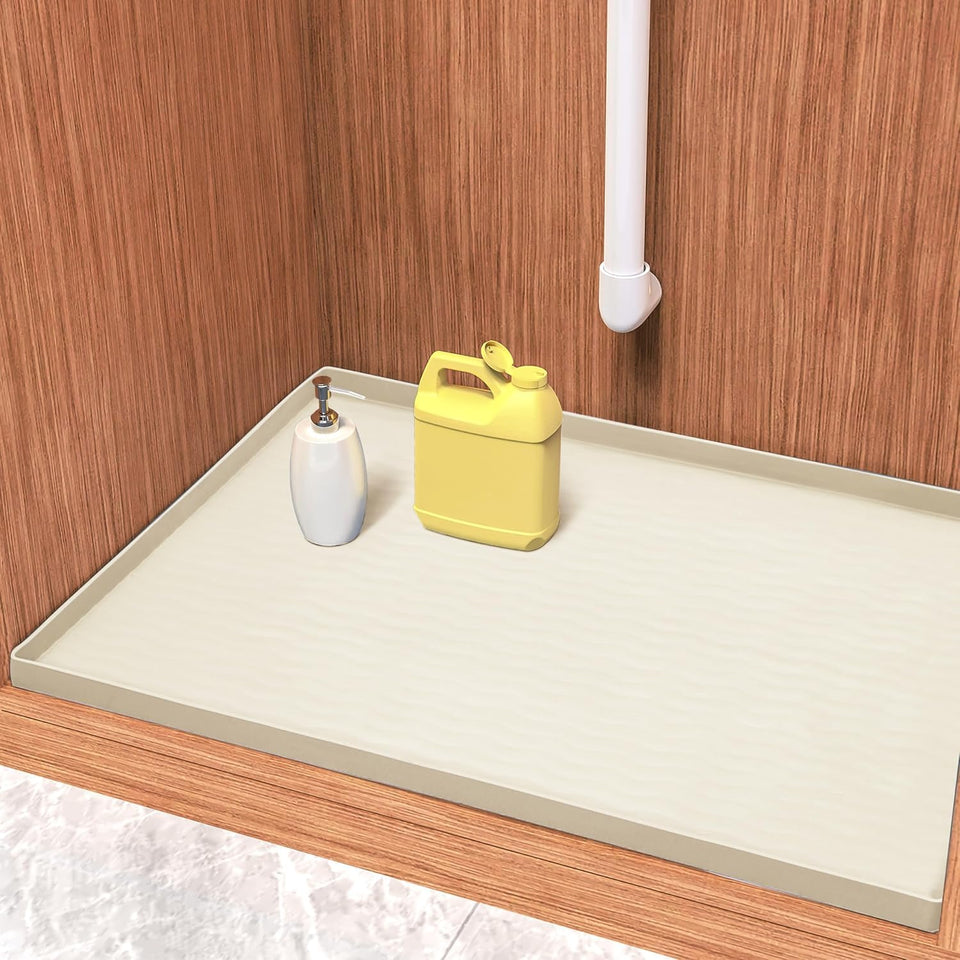 URMONA silicone under sink mat 22x14 cream protects cabinets from leaks.