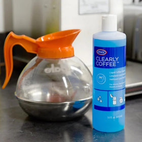 Urnex Clearly Coffee pot cleaner NSF certified for metal compatibility and safety.