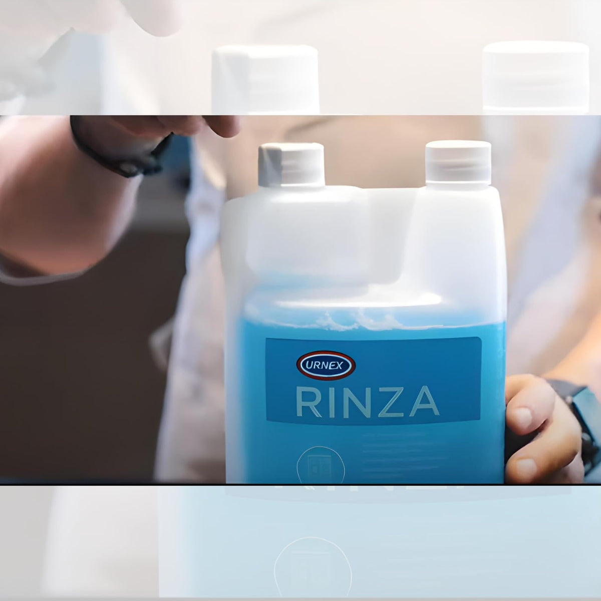 Urnex Rinza steam wand cleaning setup for dairy equipment