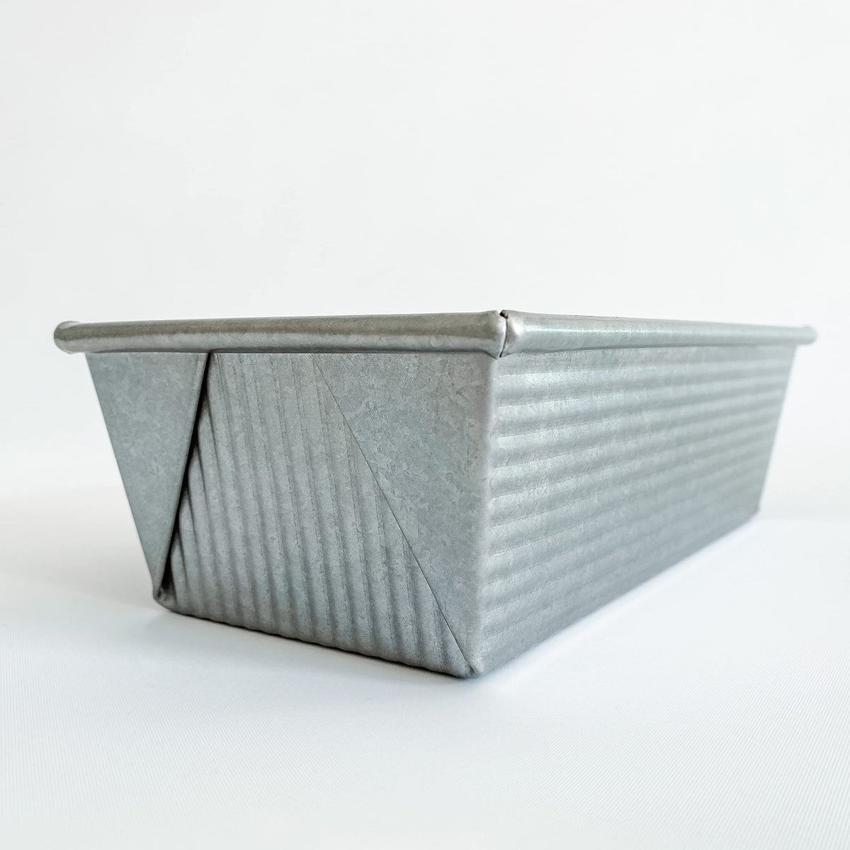 USA Pan 1145LF loaf pan side view shows sturdy rim for warp resistance