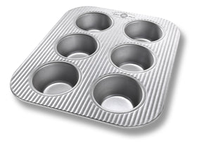USA Pan 6-cup muffin pan in toaster oven for even baking and easy cleanup.