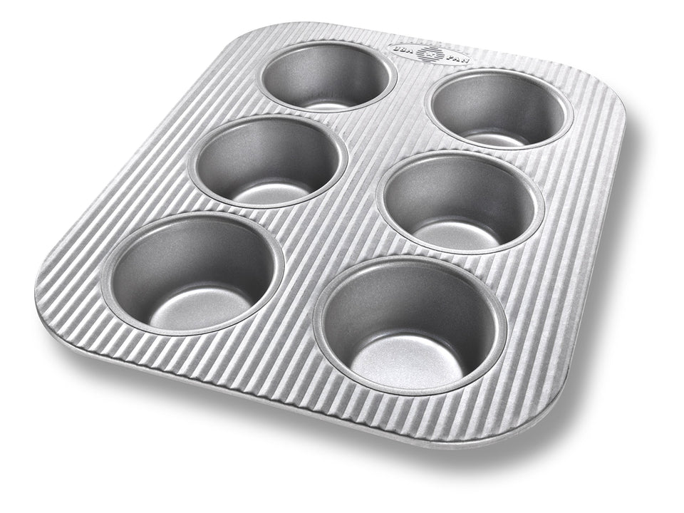 USA Pan 6-cup muffin pan in toaster oven for even baking and easy cleanup.