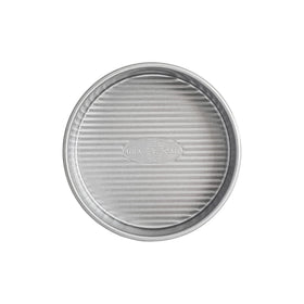 USA Pan 6-Inch Round Cake Pan top view highlighting Americoat Plus II nonstick coating for easy release.
