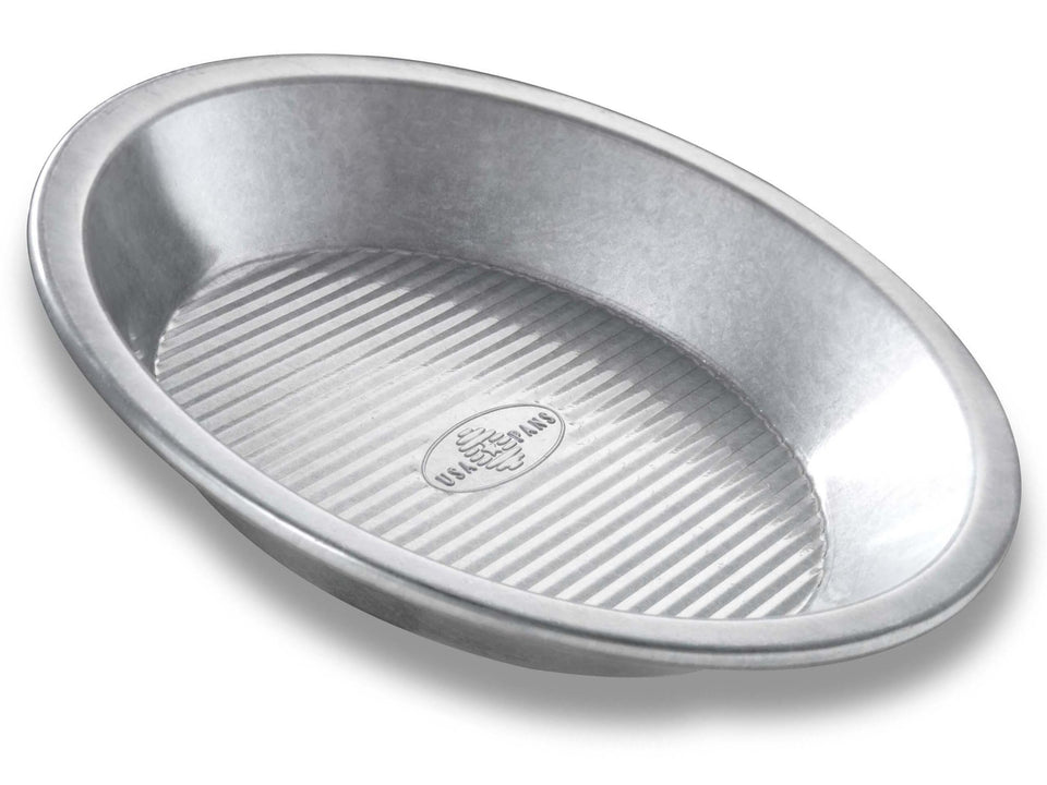 USA Pan 9-Inch Pie Pan top view highlighting durable aluminized steel for even baking
