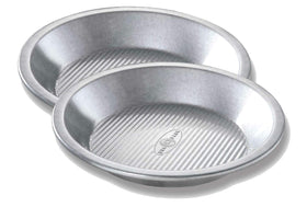 USA Pan 9-inch pie pan with corrugated surface for even baking and easy release.