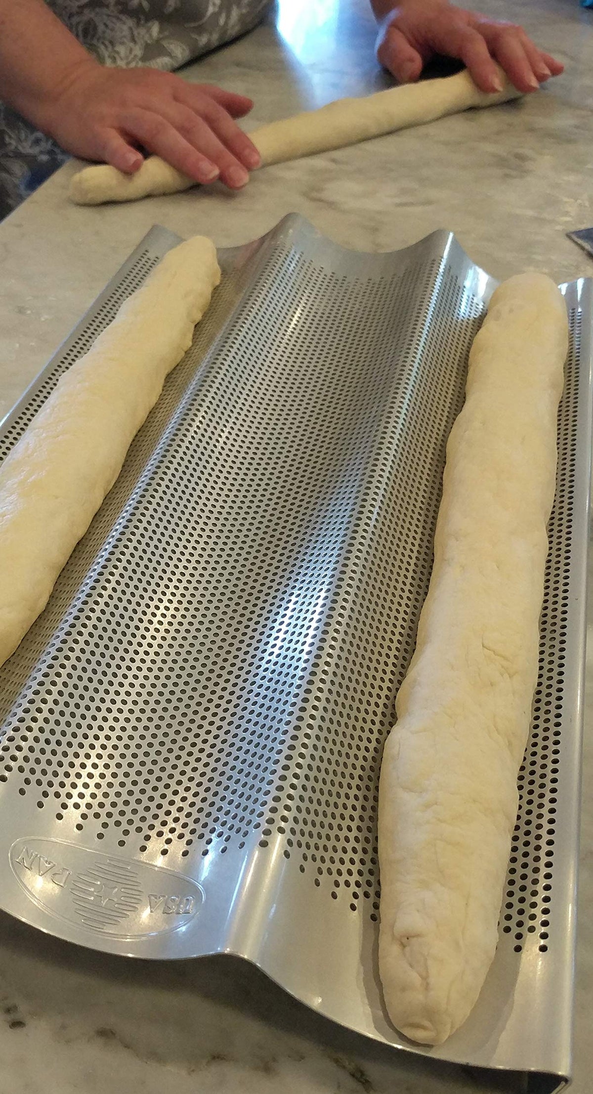 USA Pan baguette pan perforated bottom aiding moisture release for crispy crusts