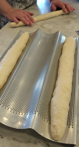 USA Pan baguette pan perforated bottom aiding moisture release for crispy crusts