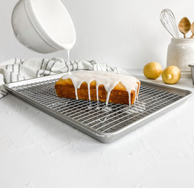 Cookies baking on USA Pan half-sheet pan with even browning.