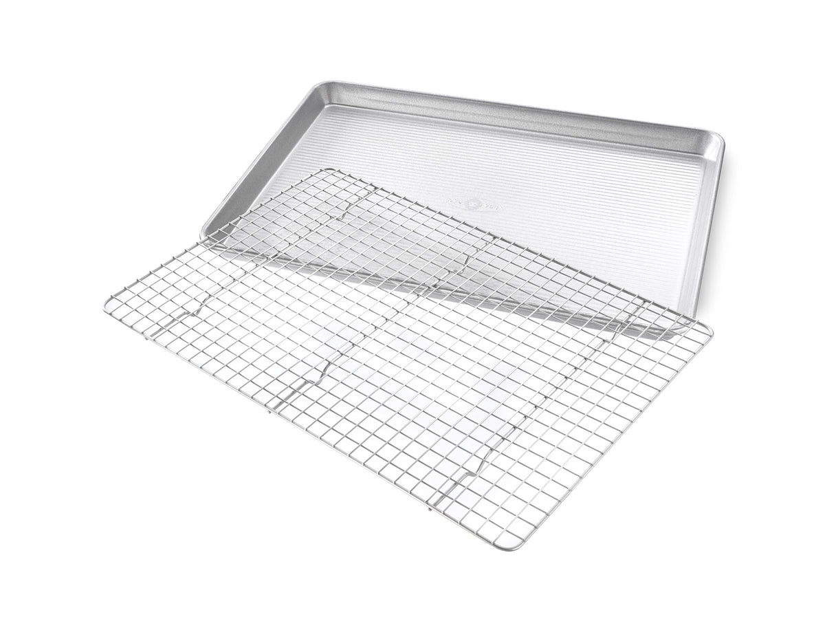 USA Pan cooling rack inside half-sheet pan for elevated, uniform cooling.