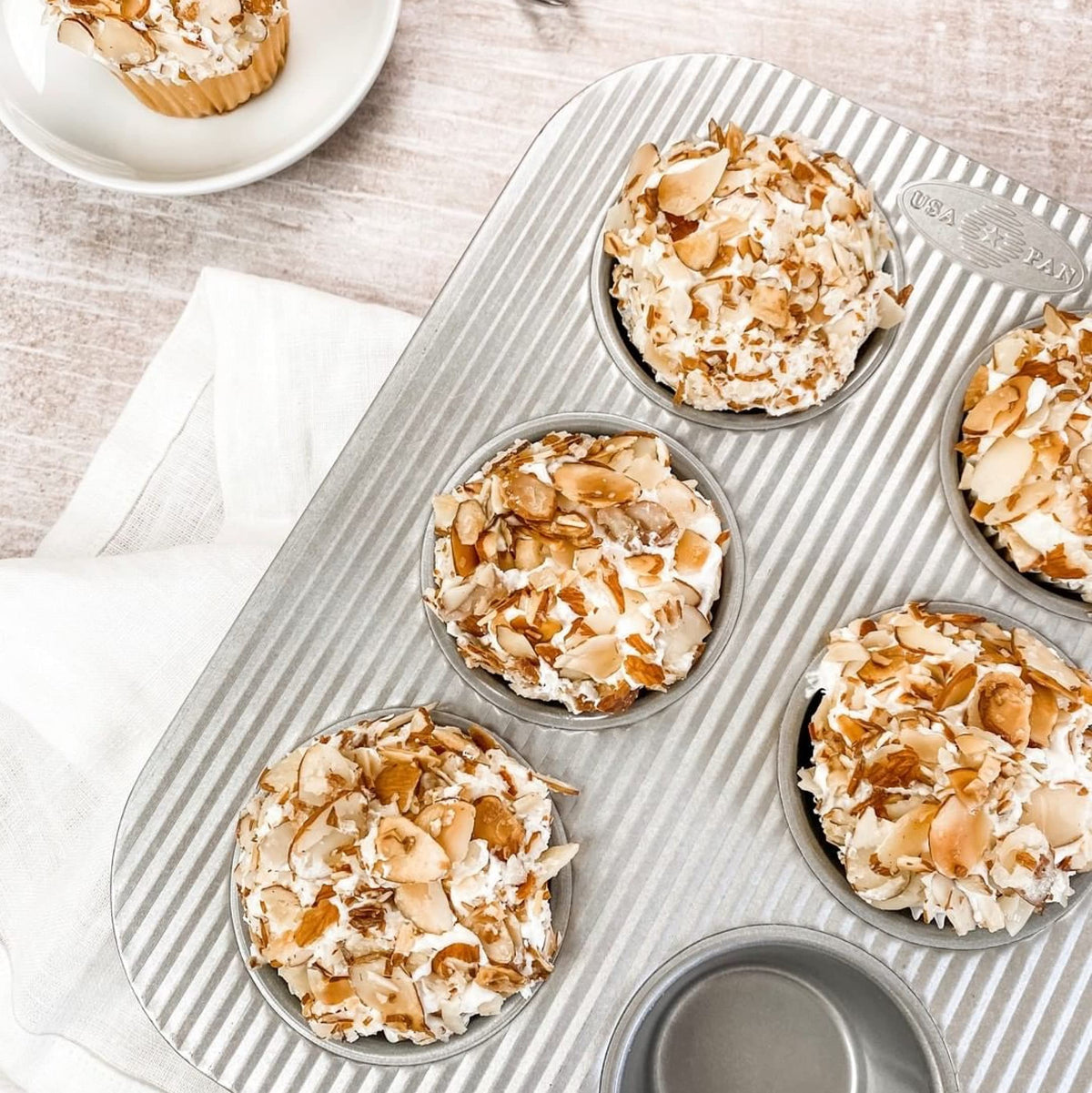 USA Pan Jumbo Texas Muffin Pan in aluminized steel for durable, even heating.