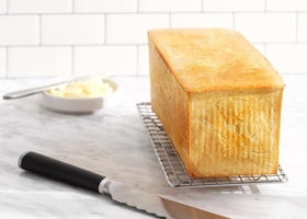 Pullman lid slides securely for consistent dough rise and flat tops.