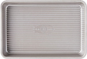 USA Pan mini sheet pan set front view highlights sturdy rim and compact size.