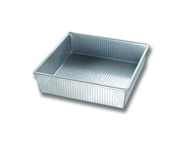 USA Pan square cake pan with corrugated surface for even browning and quick release.