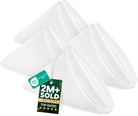 Utopia Home 24-pack napkins folded neatly on a dining table for an elegant meal.