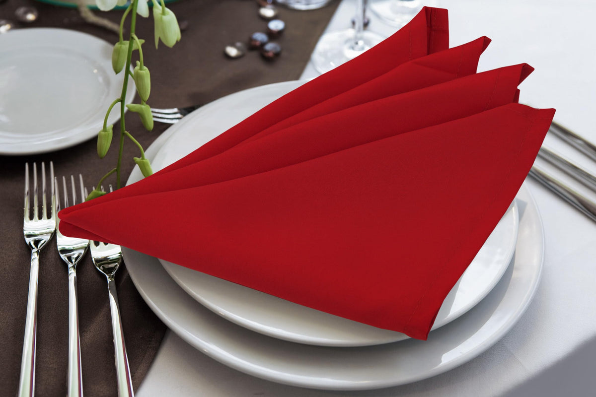 Utopia Home red napkins folded neatly on a plate for a polished table setting