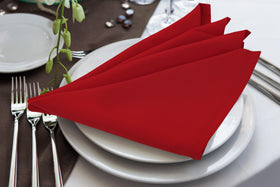 Utopia Home red napkins folded neatly on a plate for a polished table setting
