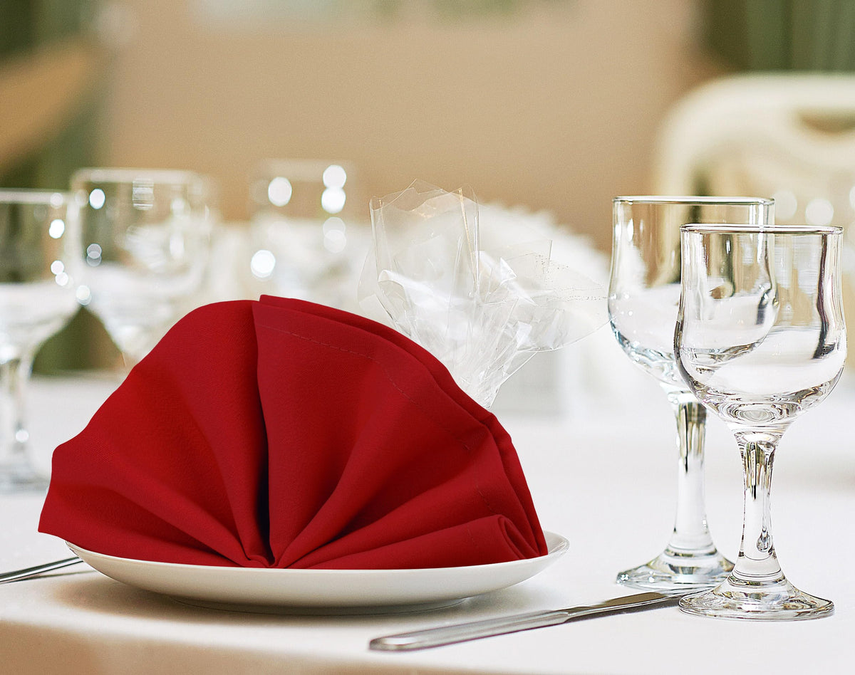 Utopia Home red napkins at a wedding table, suggesting elegant settings and guest comfort