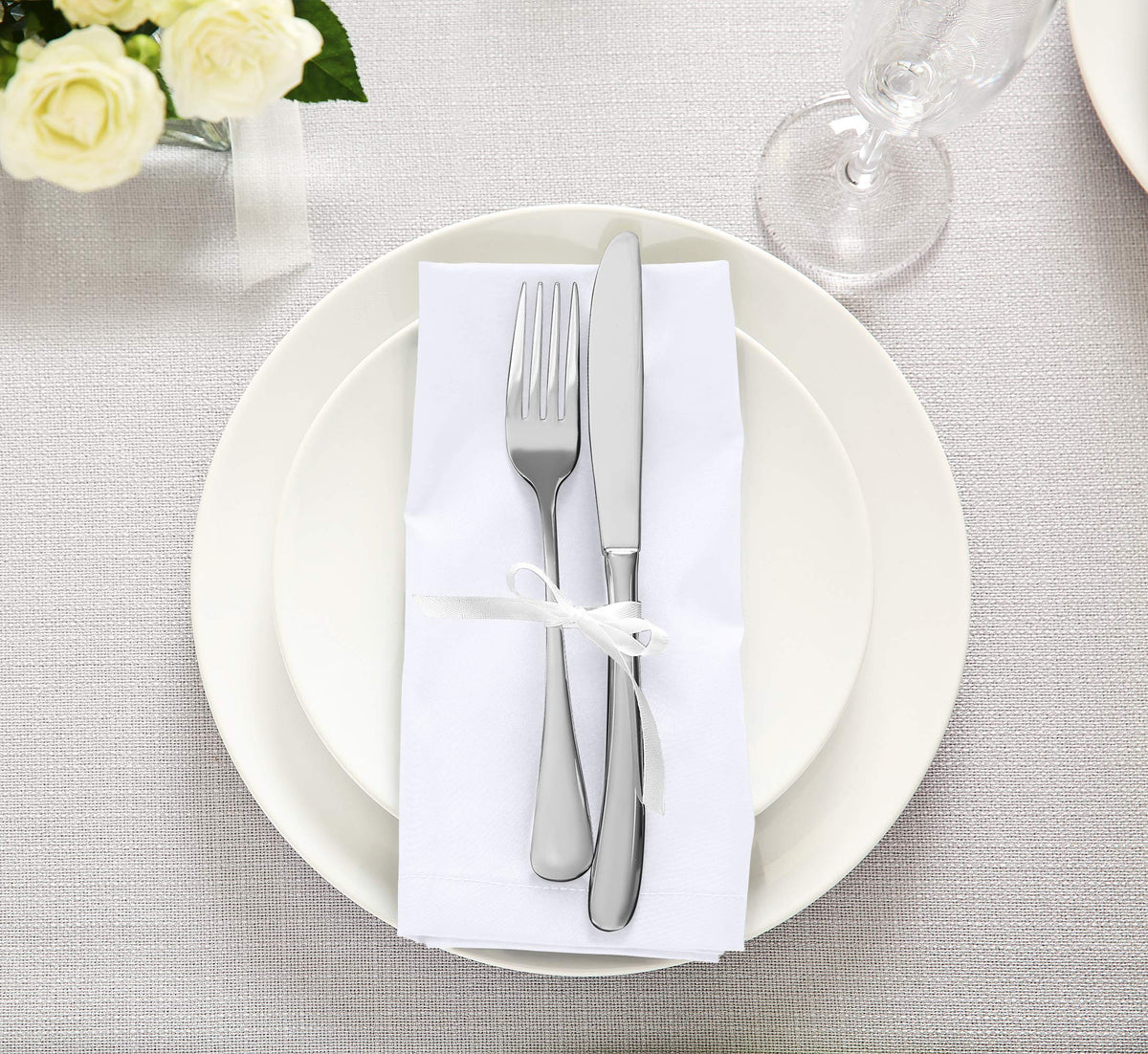 Hotel table arrangement featuring Utopia Kitchen napkins.