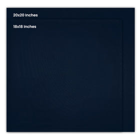 Folded navy blue cloth napkins on a charger for weddings and upscale events