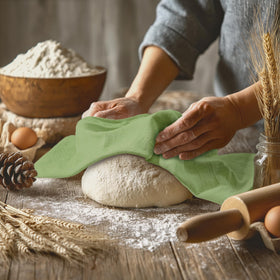 Utopia Kitchen sage green towel drying hands after kitchen tasks