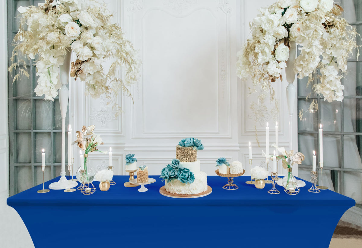 Vibrant royal blue Utopia Kitchen spandex tablecloth enhances displays and branding.