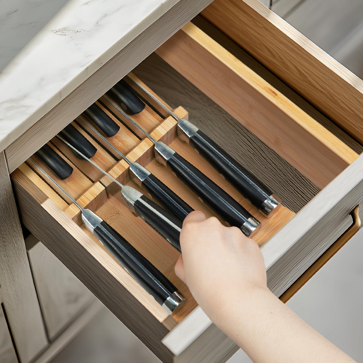 Utoplike bamboo knife-slot configuration holds nine blades for organized access.