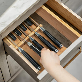 Utoplike bamboo knife-slot configuration holds nine blades for organized access.