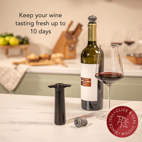 Grey Vacu Vin wine stopper in use preserving aroma after opening.