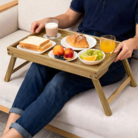 VaeFae Acacia Bed Tray used for dining in a sofa setup