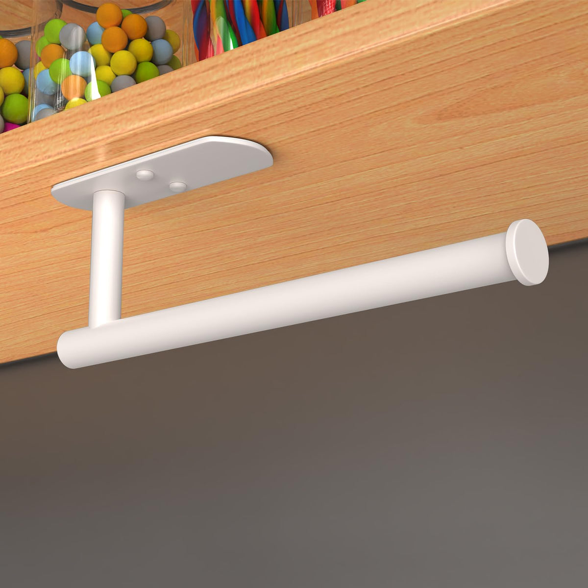 Adhesive pad mounting on a clean white wall with VAEHOLD label