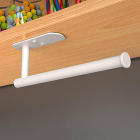 Adhesive pad mounting on a clean white wall with VAEHOLD label