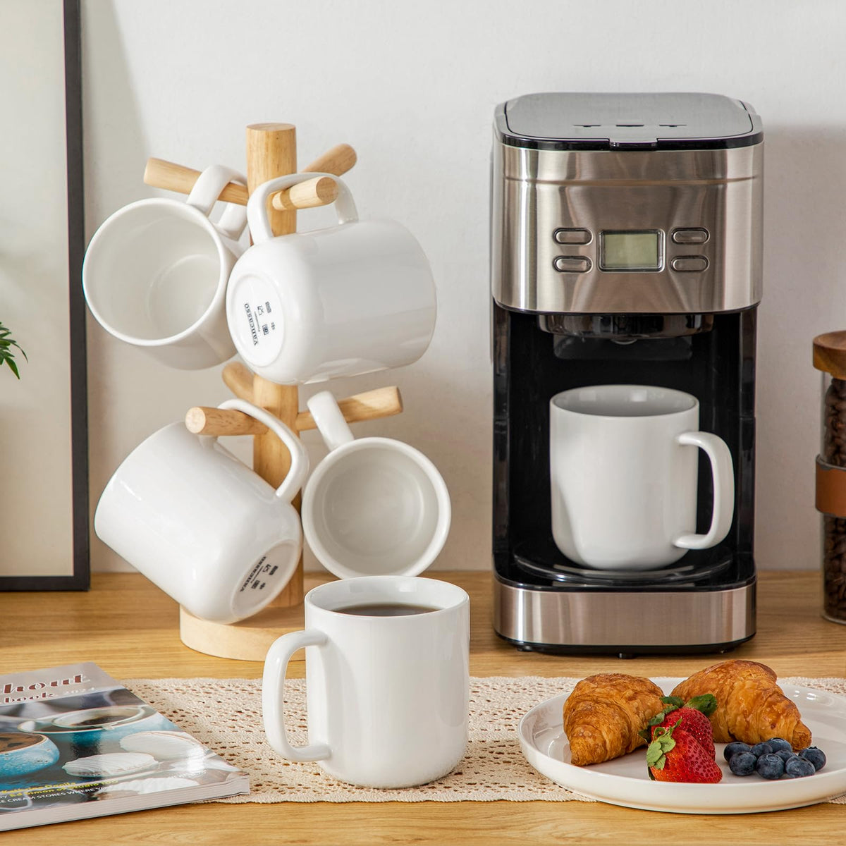 Vancasso warm ivory mug held by hand on kitchen counter