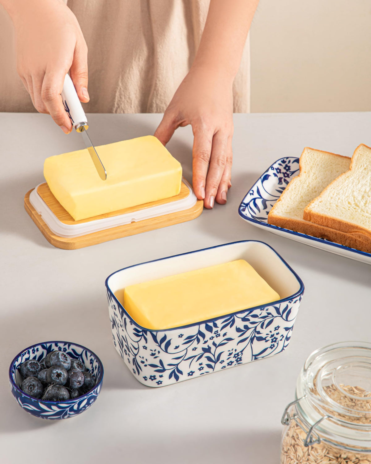 Vancasso Selene butter dish on counter with floral pattern display