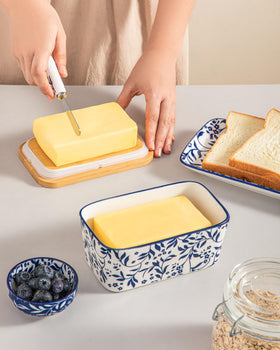 Vancasso Selene butter dish on counter with floral pattern display