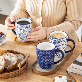 Vancasso Selene blue floral mugs for cozy coffee breaks.