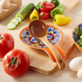 Multi-purpose rest holds spoons, spatulas, and tongs between uses.