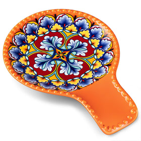 Vancasso orange spoon rest on stove-top adds color and counter protection.