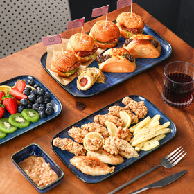Vancasso Stern rim detail emphasizes edge for spill-free serving.