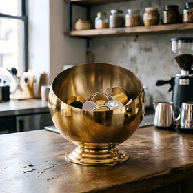 VAWNKUKN gold pod organizer showcases a chic countertop display for quick caffeine access.