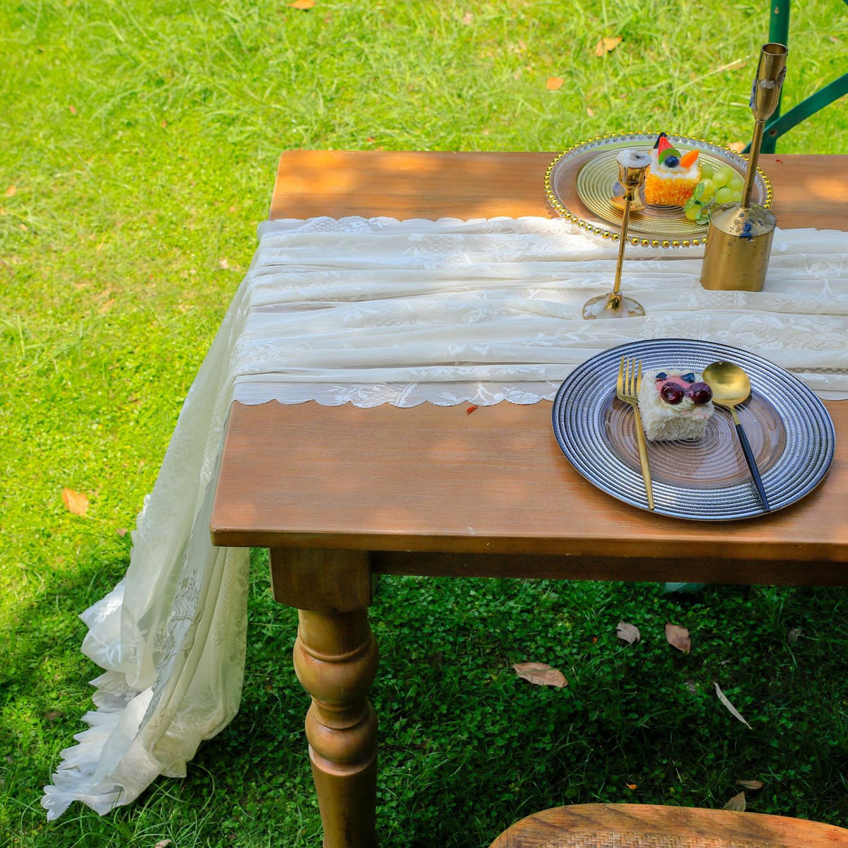 VCTOPS table runner on long banquet table with candles and florals