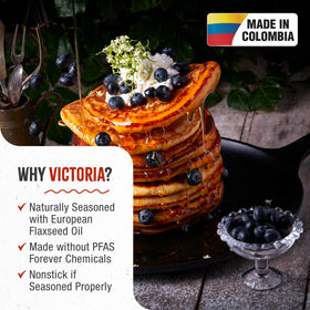Victoria comal with loop handle for secure carrying from grill to campfire.