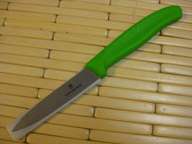 Victorinox paring knife with green handle, ergonomic grip for comfortable trimming.