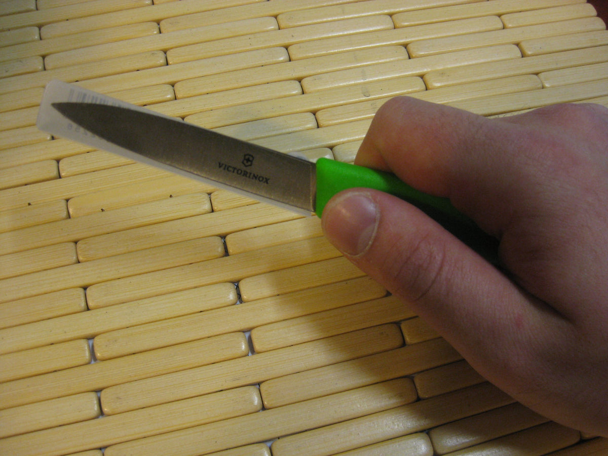Victorinox paring knife in action peeling delicate fruits and prepping.